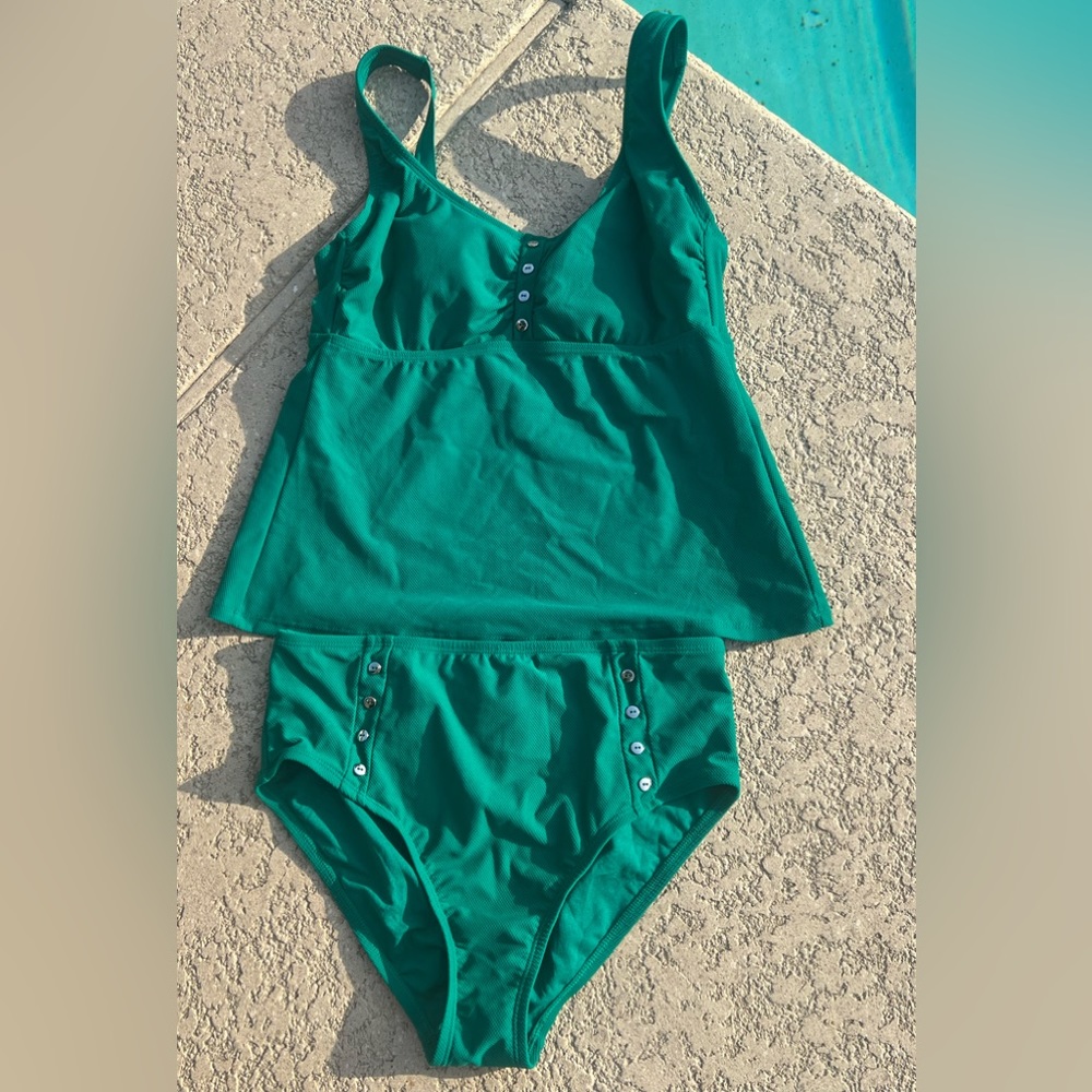 Adorable 2 piece swimsuit. Top is size large, bottoms are size medium.